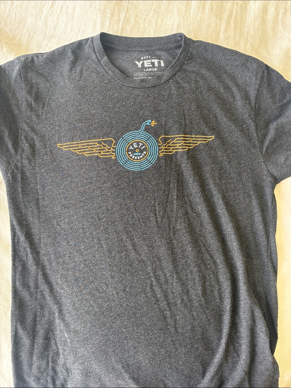 Yeti Charcoal Short Sleeve Tee with Blue & Gold Wing Graphic